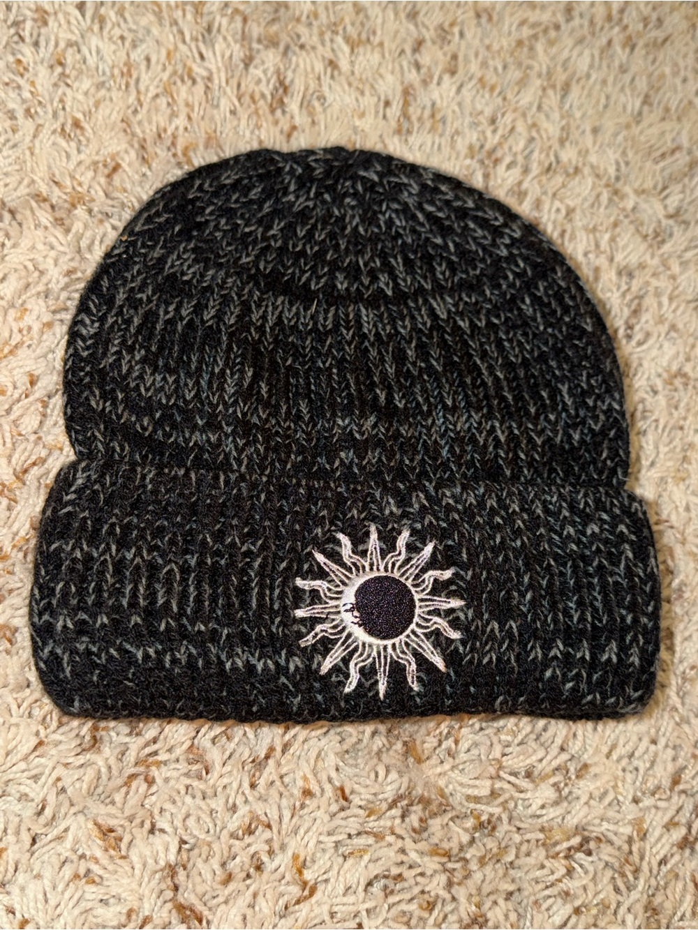 Black/grey heathered knit hat embroidered with sun/moon from Urban Outfitters